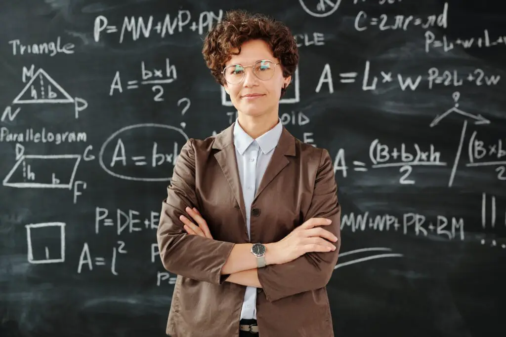 Woman standing in front of blackboard