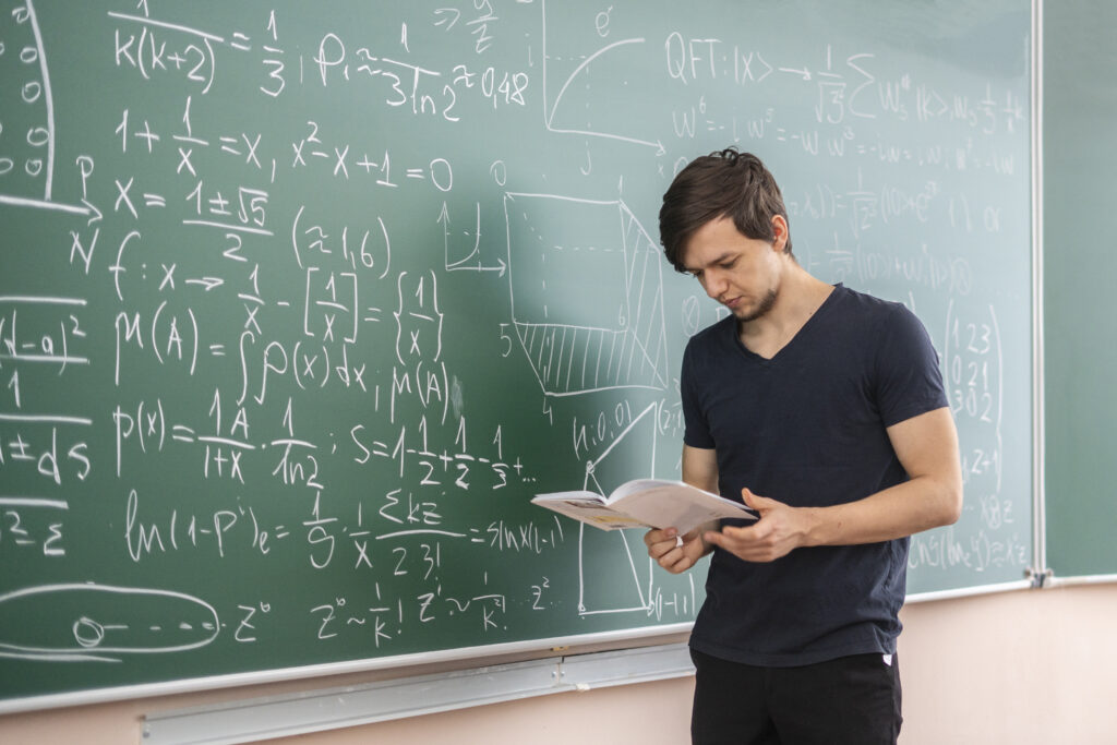 pupil doing homework on blackboard