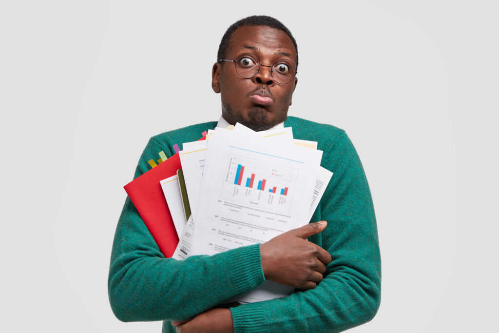 African American man holding documents