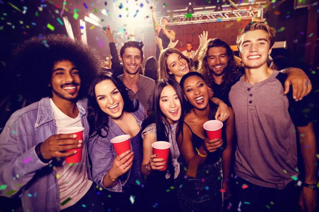 photo-of-college-students-in-bar-drinking-listening-to-music