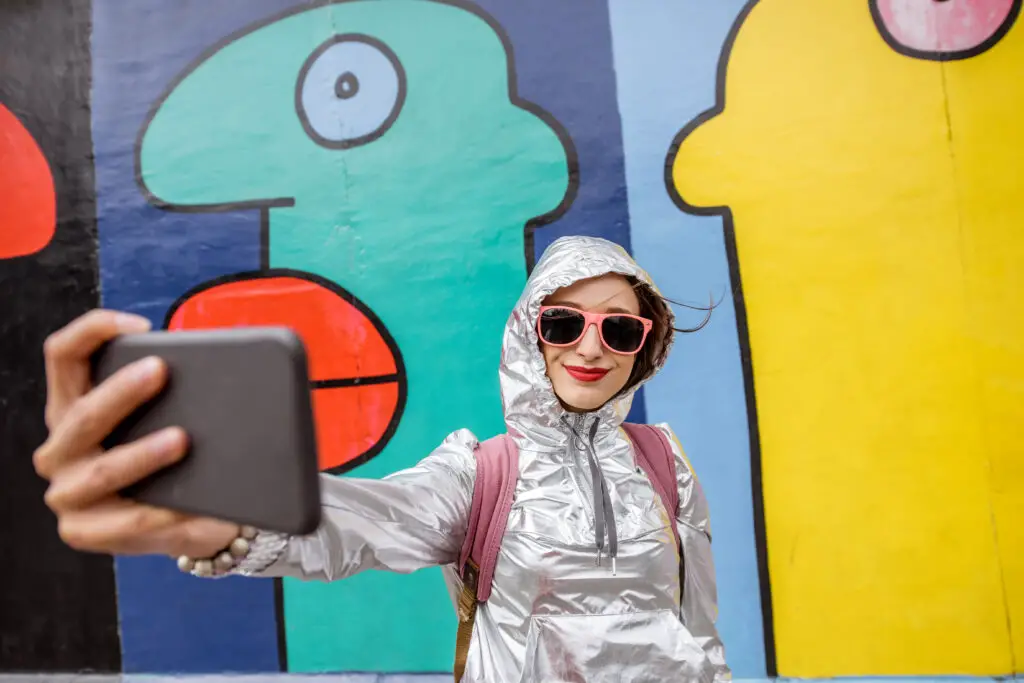 Young woman tourist making selfie photo