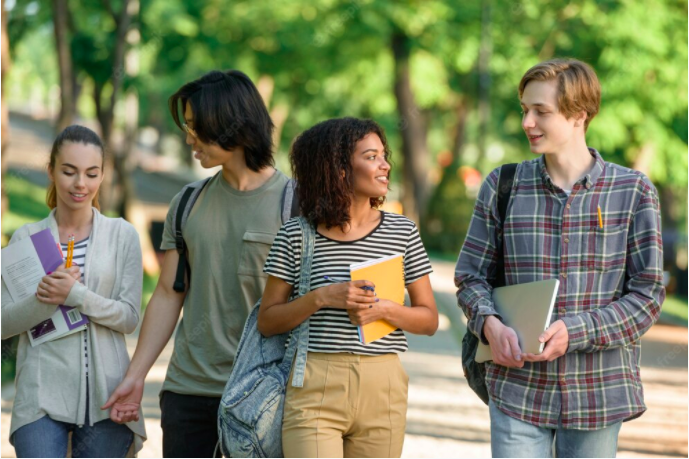 college students walking on campus as part of their eco-friendly lifestyle