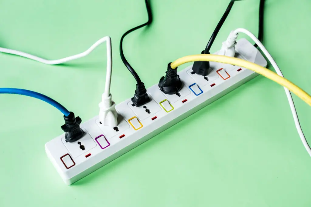 a white extension cord with multiple plugs connected