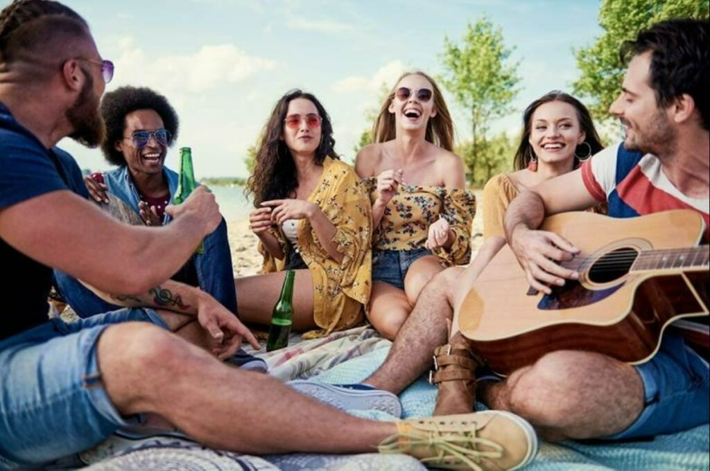 Group of friends enjoying on the beach