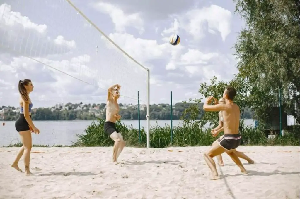 Group of friends playing volleyball on the beach
