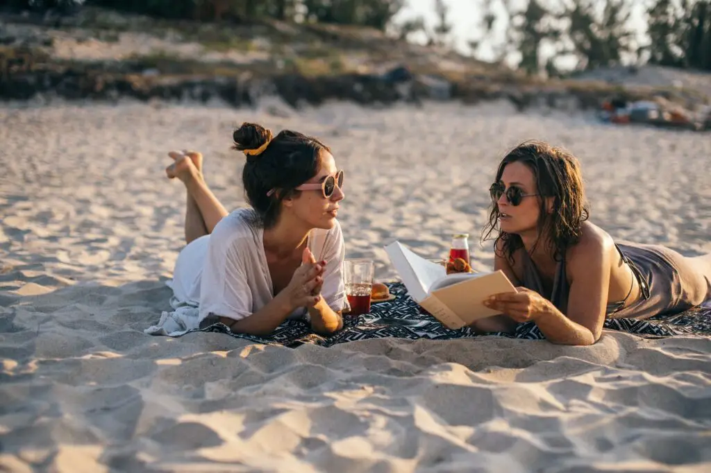 Women reading on the beach