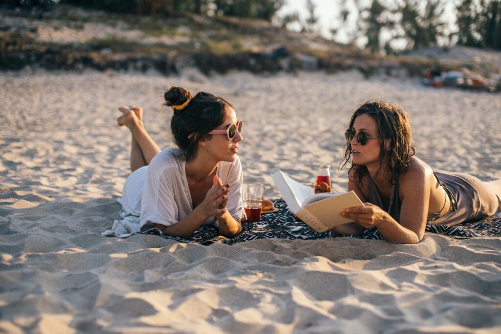 Women reading on the beach