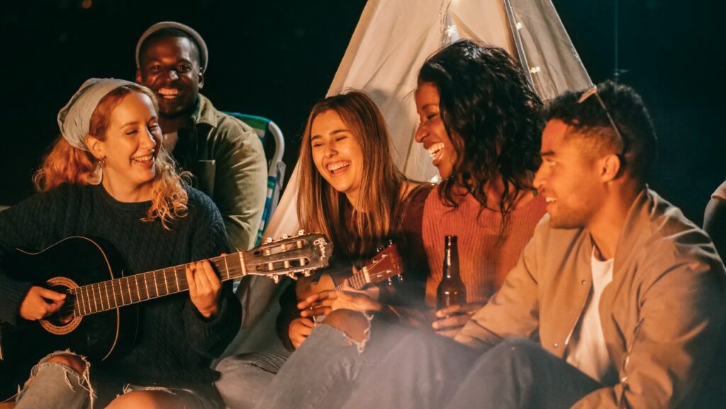 Group of friends singing and drinking 