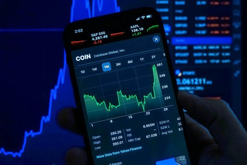 a phone screen showing cryptocurrency trends in Coinbase