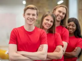 happy-college-students-in-red-tee-shirts-extracurricular-group