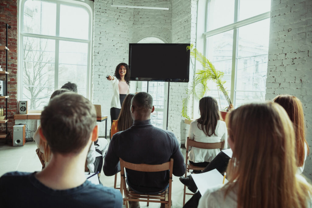 happy and confident college student speaking in front of class after calming her nerves