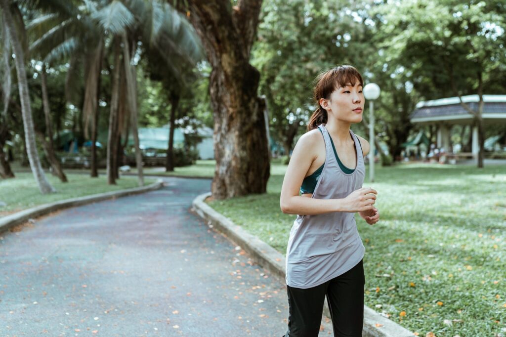 young college student on a morning jog to expel nervous energy before presentation