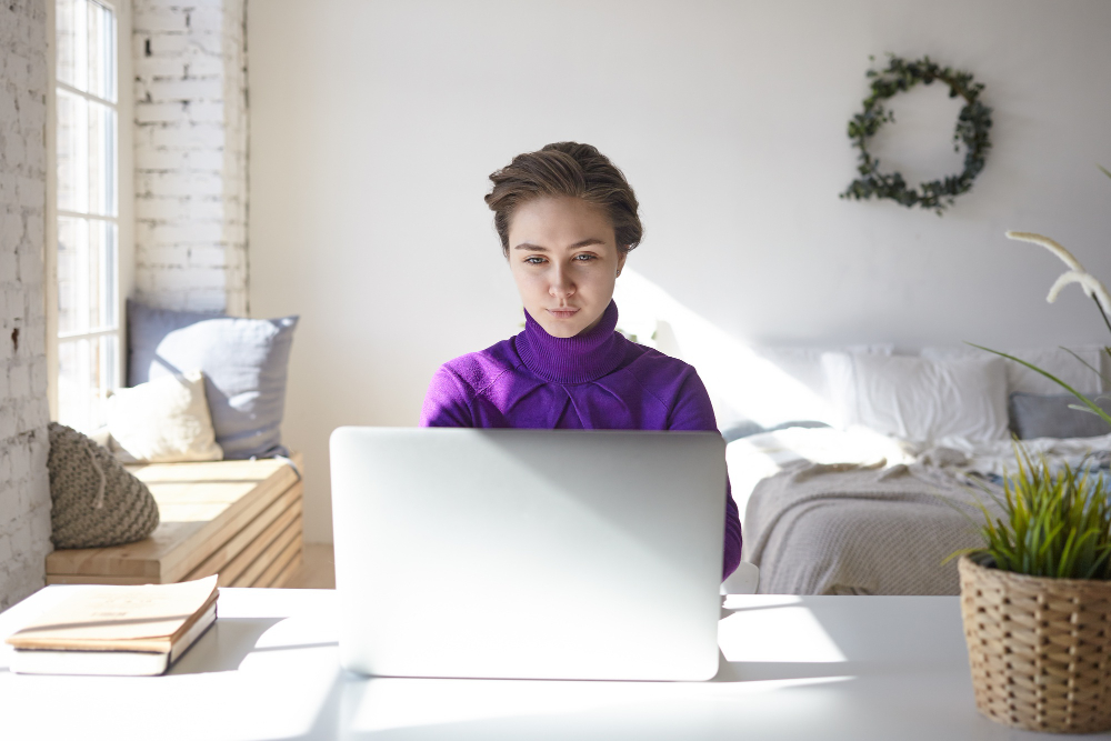 photo-of-focused-female-writing-resume-after-college