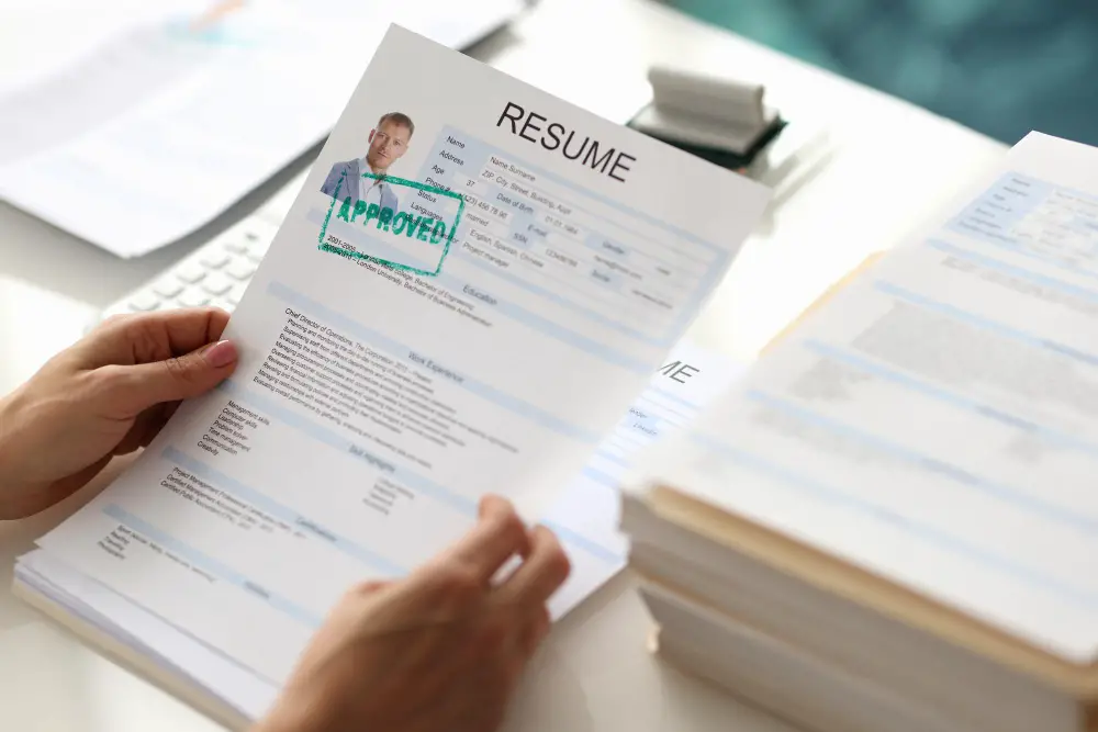 photo-of-one-page-resume-held-by-recruiter