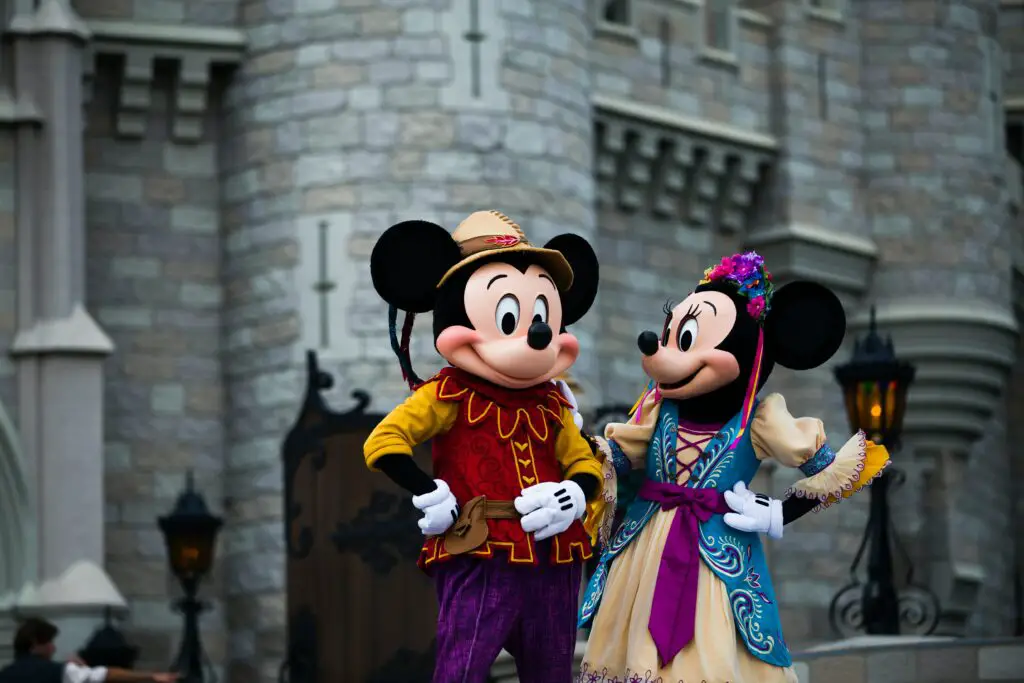 Mickey and Minnie Mouse mascots performing at a Disneyland show