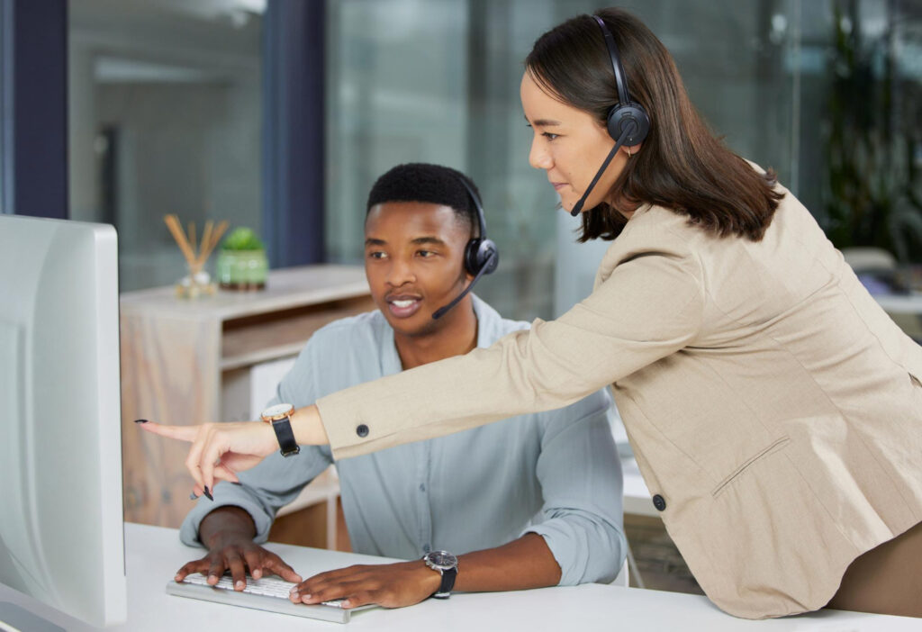 female supervisor teaching the usual work processes to a new hire