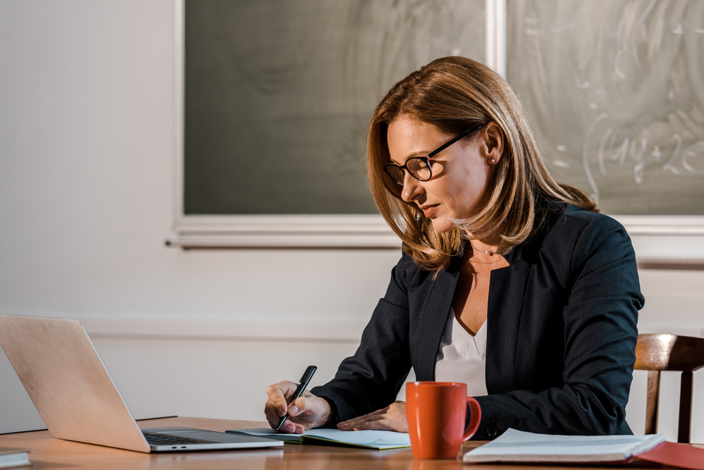 female-professor-writing