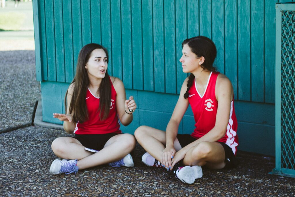 two undocumented students talking while taking a break from school sports and clubs