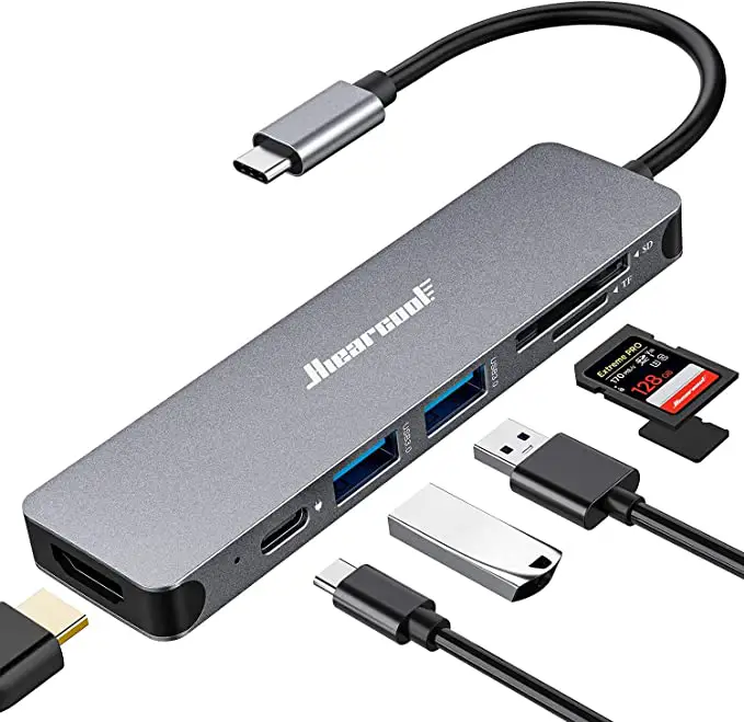 Silver Hiearcool USB multiport adapter with various tech used for college like cables, flash drive, and SD card 