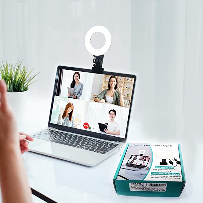 Selfila ring light attached on silver laptop bezel for online class