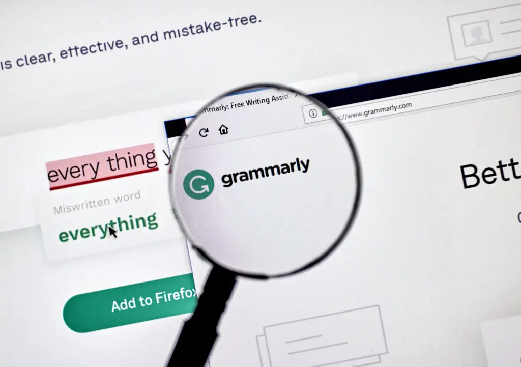a-magnifying-glass-emphasizing-the-Grammarly-logo-in-the-web-browser