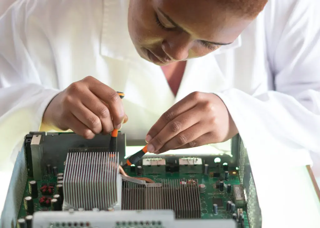 Computer Engineering college student fixing computer parts