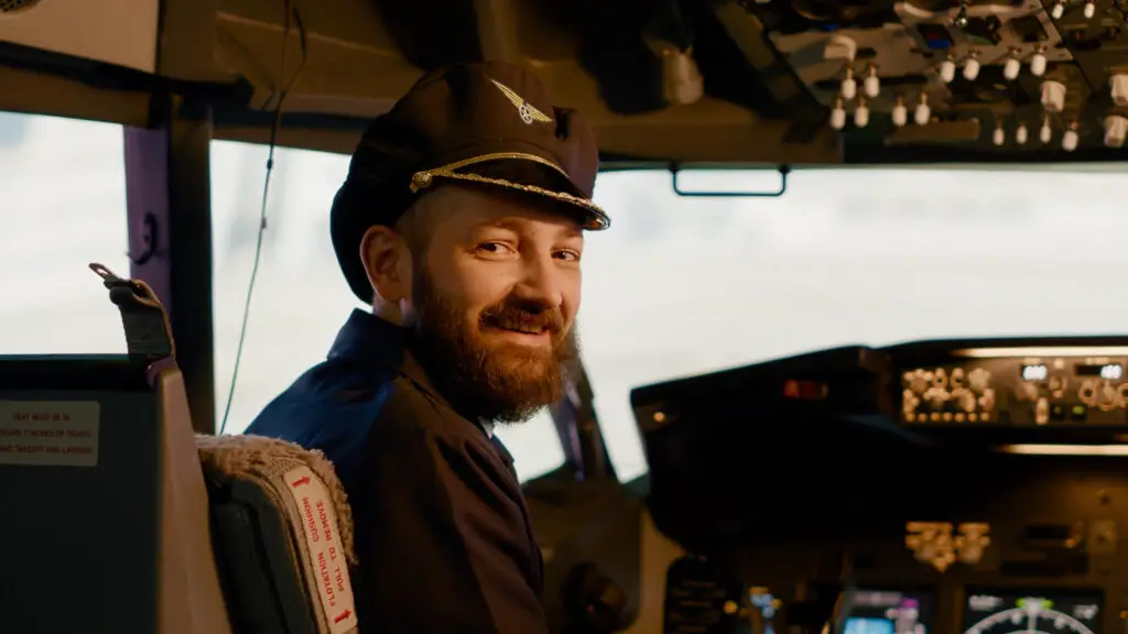 Aviation student smiling inside the cockpit