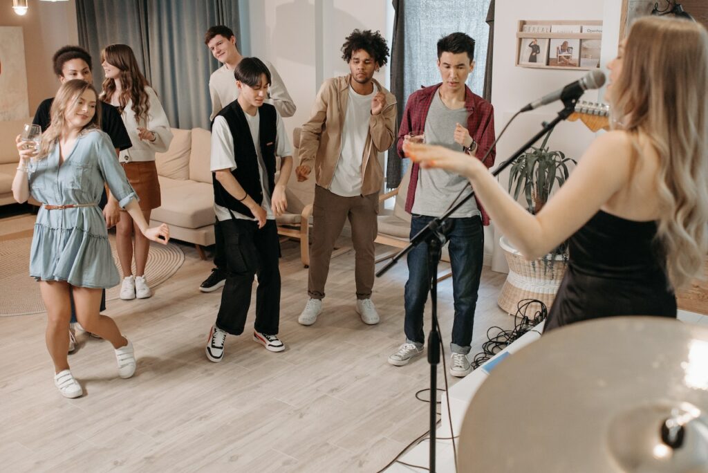 college-students-dancing-and-singing-indoors-at-a-karaoke-party