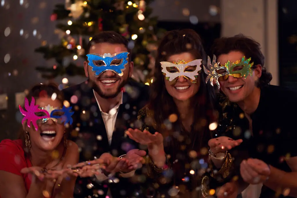 male-and-female-college-students-wearing-eye-masks-at-a-masquerade-themed-college-party