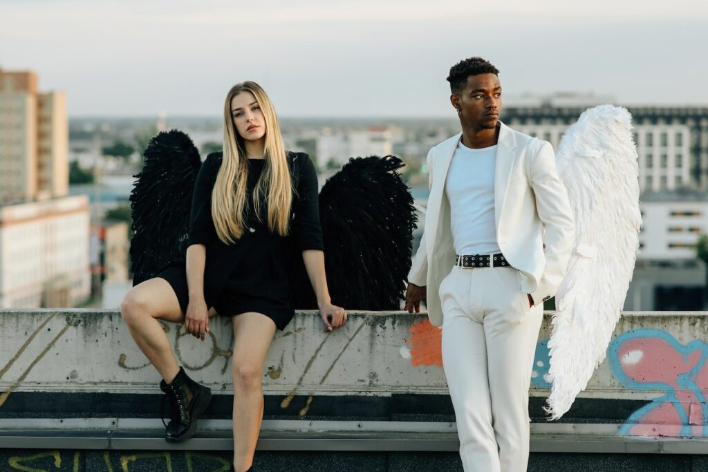 male-and-female-students-in-black-and-white-fallen-angels-costume-for-a-college-party