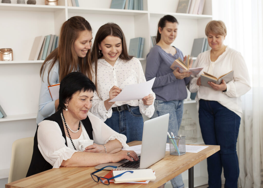 A female professor showing her detailed evaluation of class performance to her students