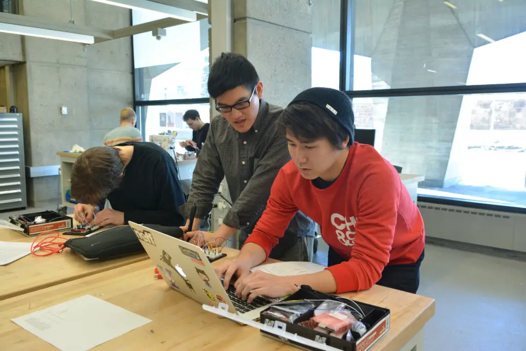 Five Yale students applying computer science lessons in their engineering projects at the Center for Engineering Innovation and Design