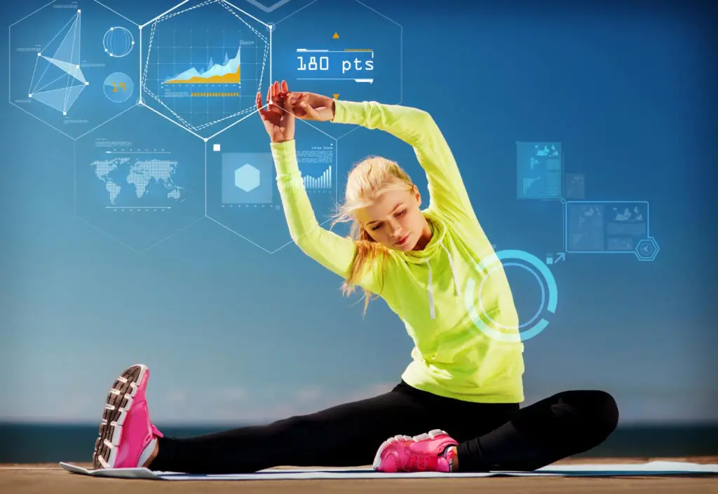 A female college athlete getting her warmup stretch assessed using a digital sports analytics device used in one of the most advanced computer science colleges in the country