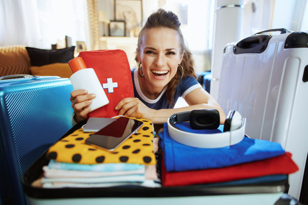 female-college-student-holding-a-first-aid-kit-from-her-college-packing-checklist