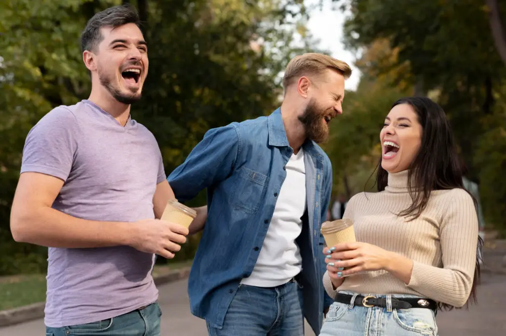  a group of college students having a laugh after hearing the weirdest college names in the US