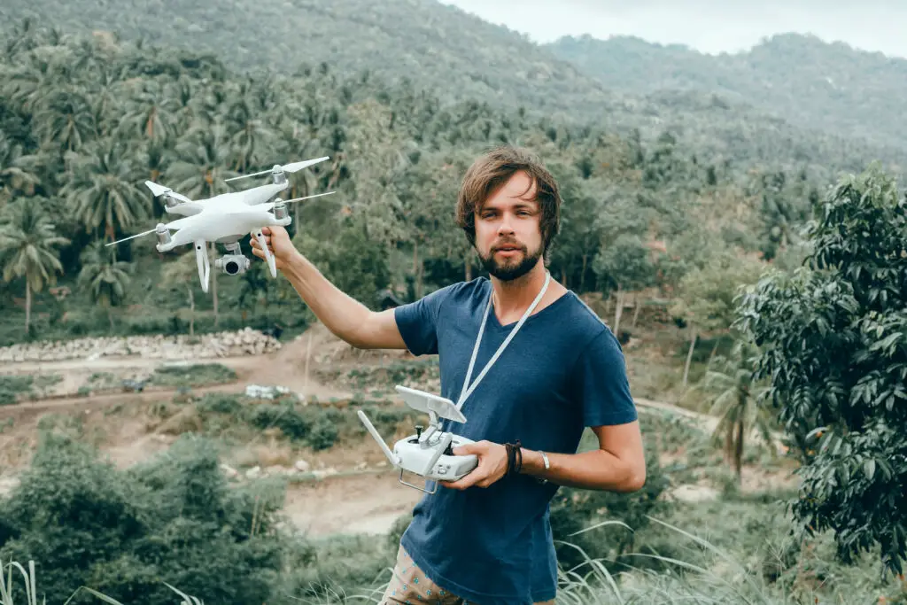 Male aeronautics major testing a drone during study abroad research program
