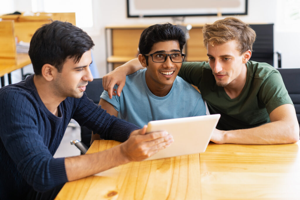 Three male students from Lovely Professional University preparing for a career planning session 