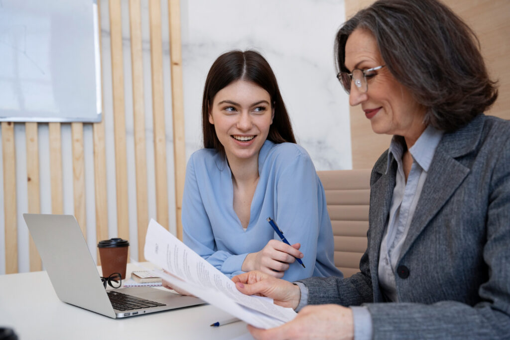 female college student discussing with financial advisor about how to pay for college by cashing in savings