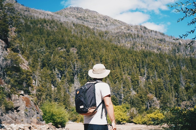 male-college-student-enjoying-the-view-at-Lago-Puelo-National-Park-in-Argentina-during-study-abroad-program