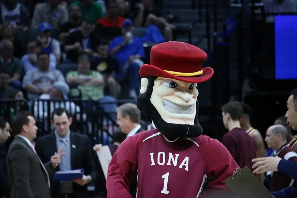 An Iona University Gael mascot cheers for a basketball game in the court