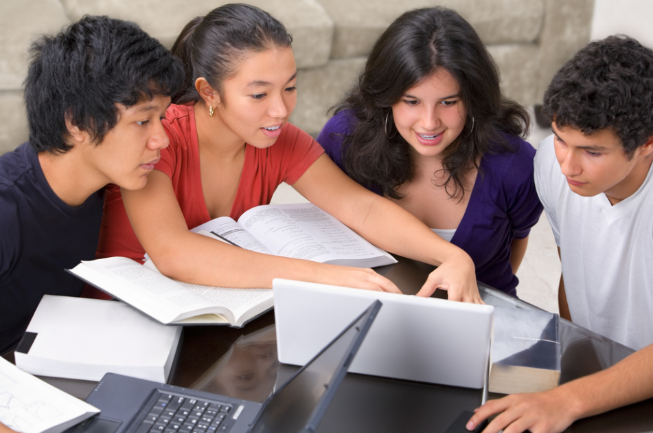 Study group of male and female multi-ethnic students discussing one of the ways to stay motivated in college