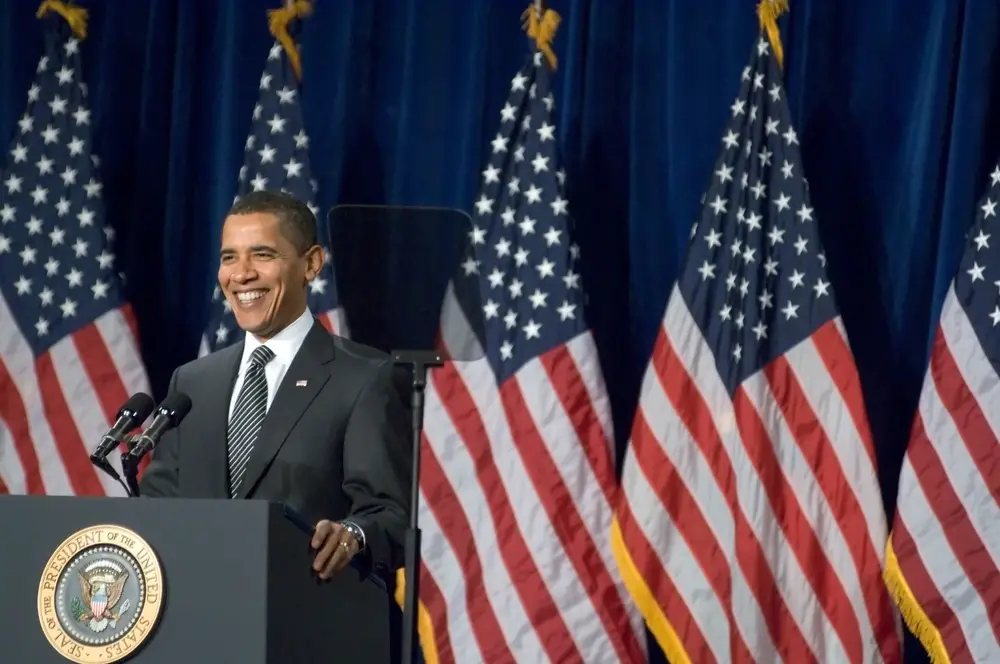 US President Barack Obama smiles while giving a speech