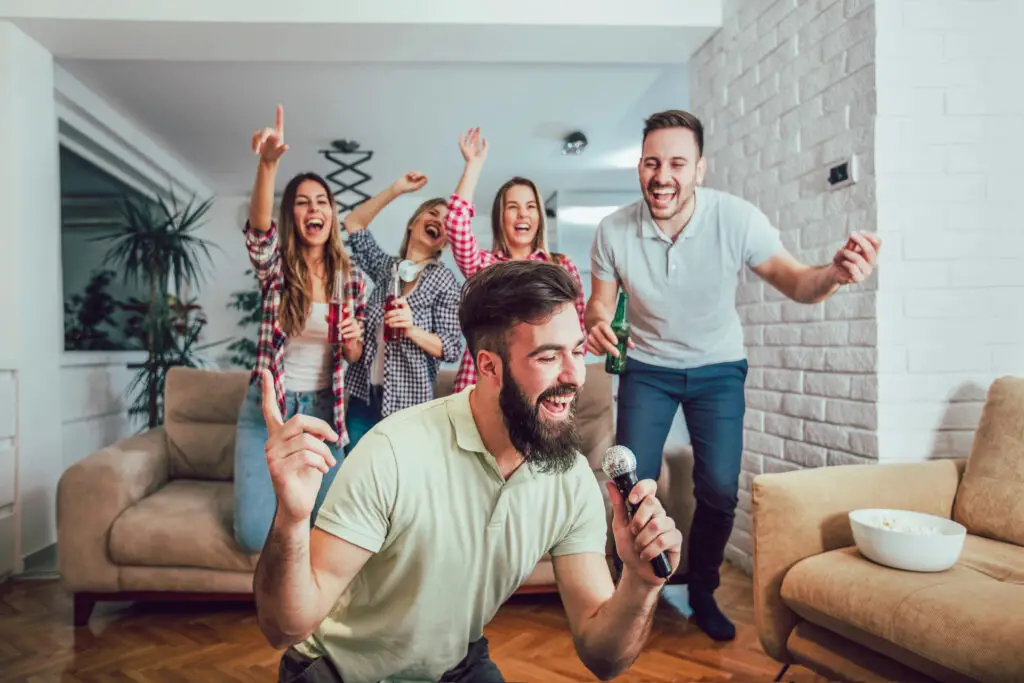 A group of people having a great time together in a comfortable living room.