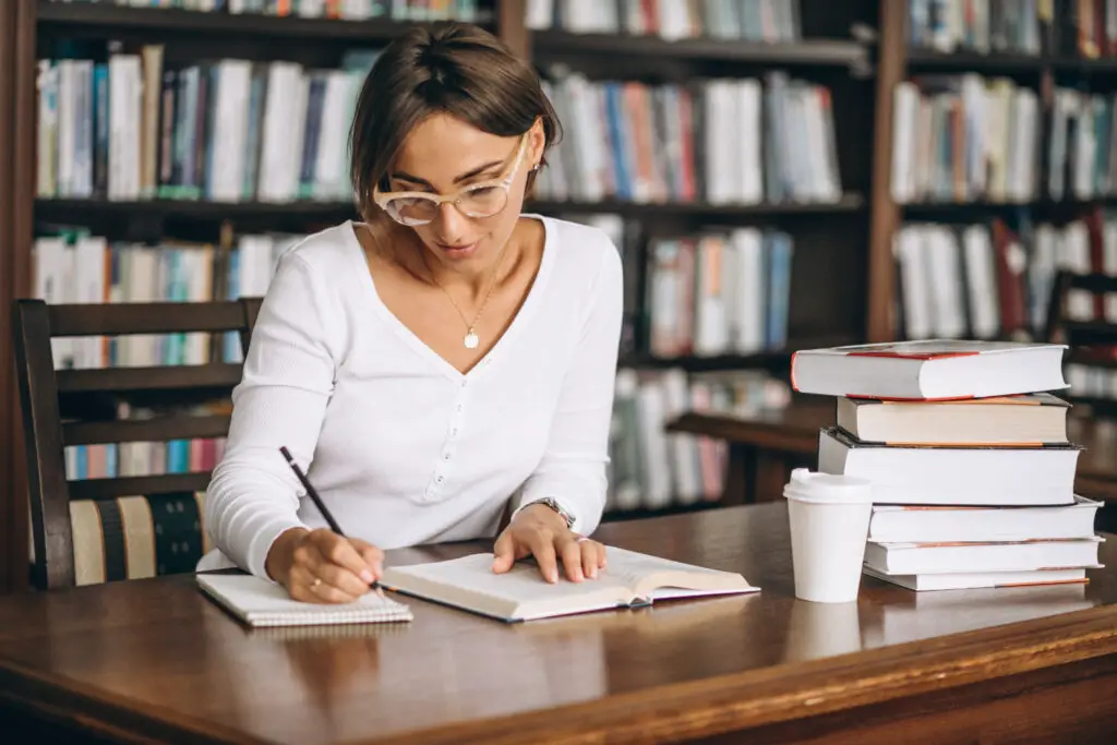 young English professor working on a new curriculum